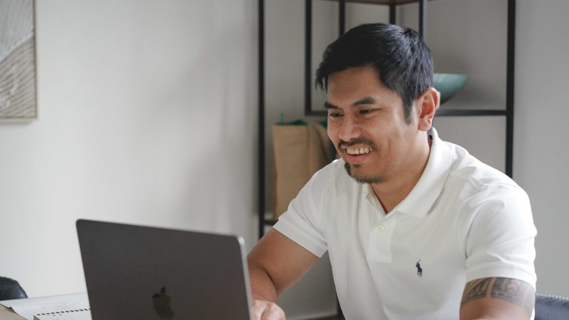 Patrick Galang working on a laptop